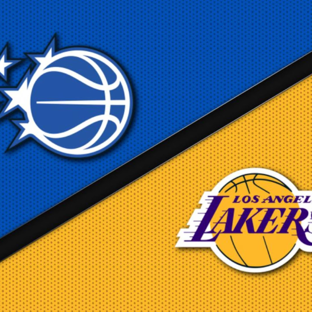 Fans cheering at Orlando Magic vs Los Angeles Lakers NBA game at Kia Center